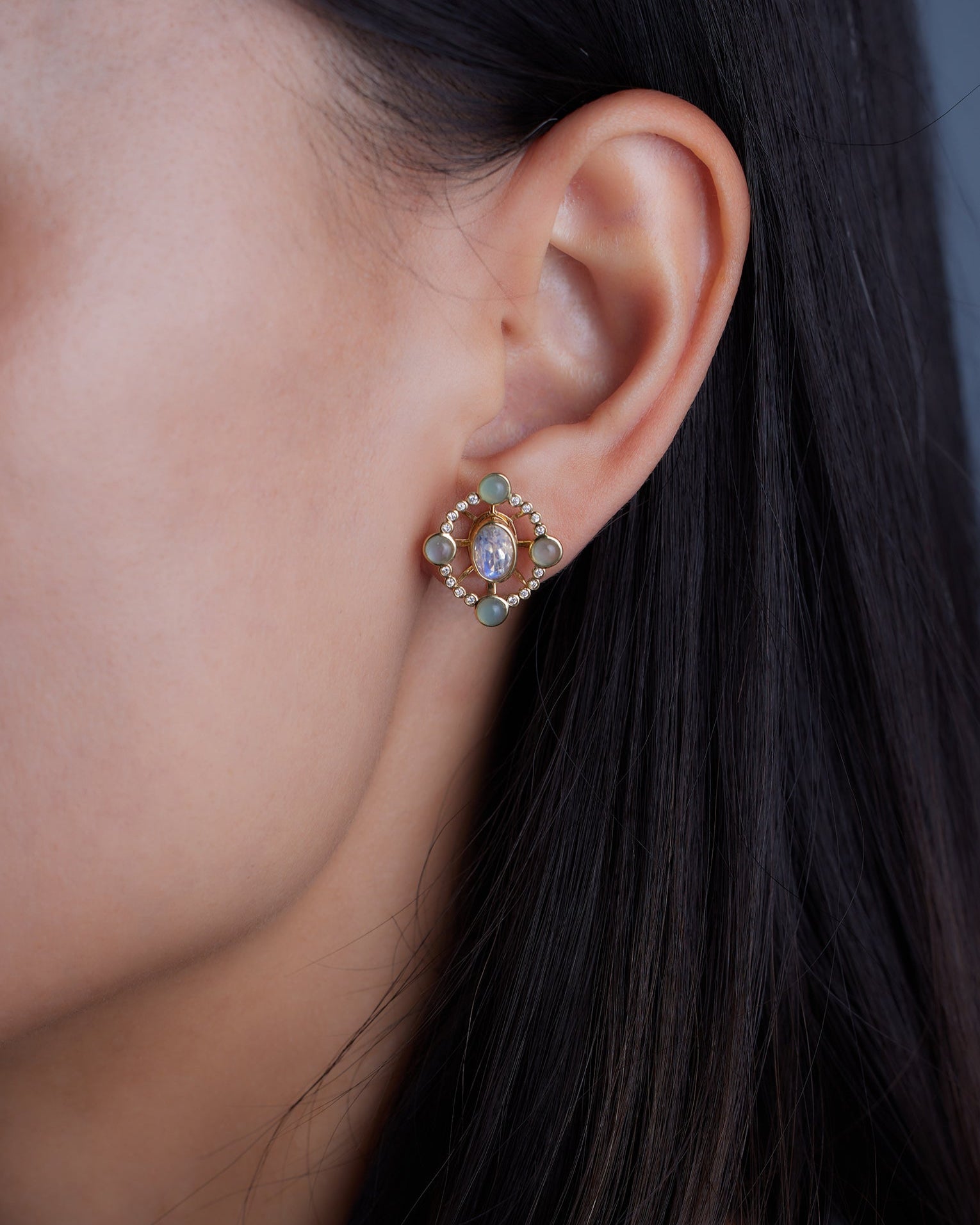 Convertible diamond earrings from Ostara’s Roma collection with moonstone studs; center stone can be customized