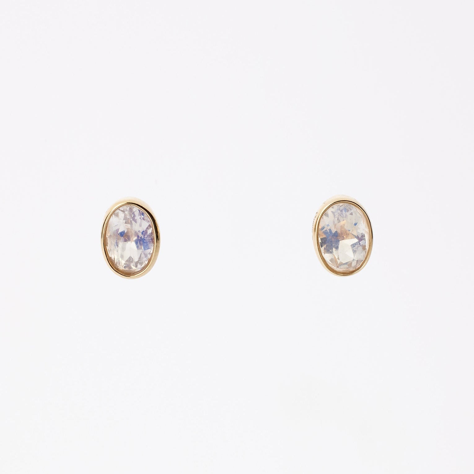Convertible diamond earrings from Ostara’s Roma collection with moonstone studs; center stone can be customized