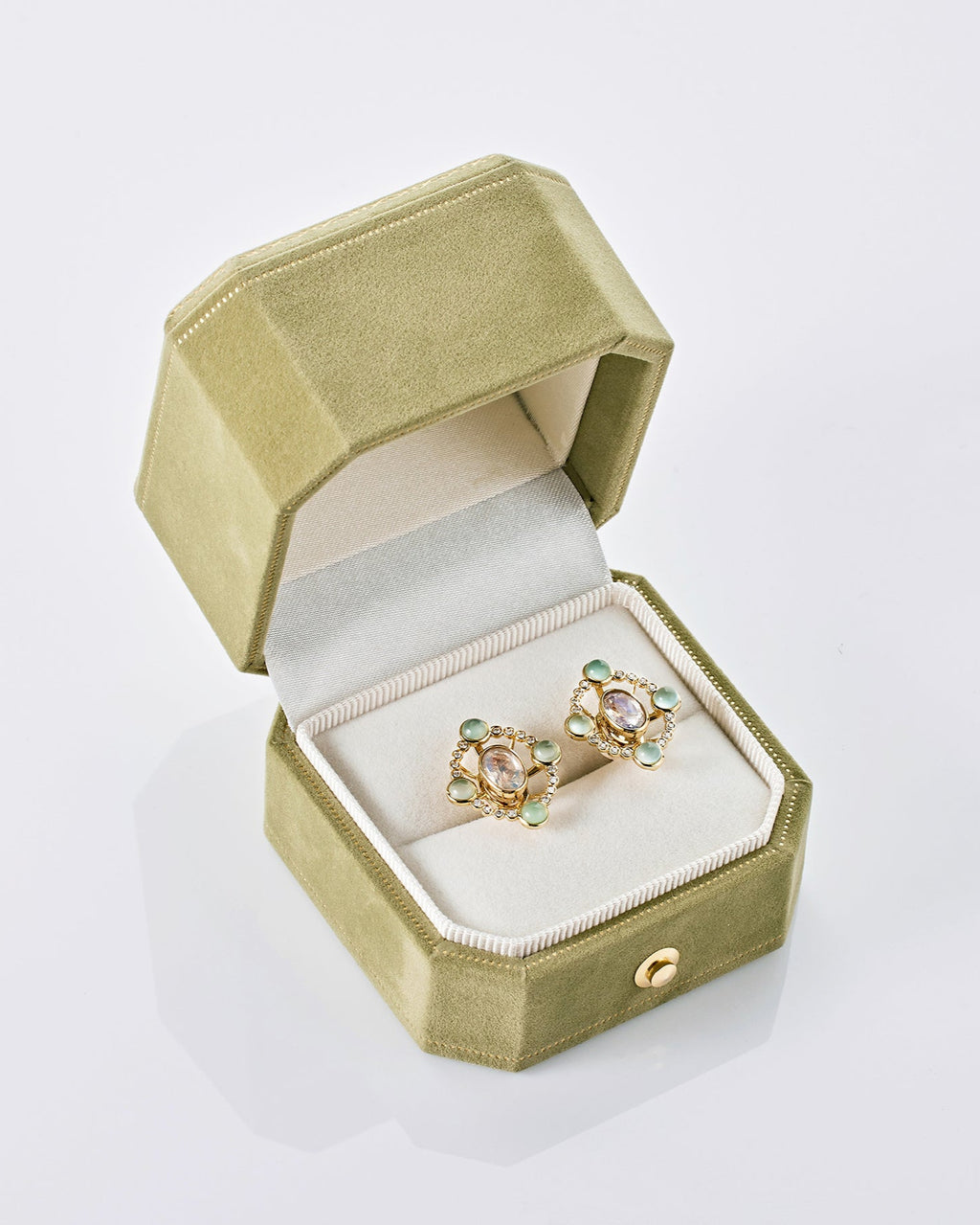 Convertible diamond earrings from Ostara’s Roma collection with moonstone studs; center stone can be customized
