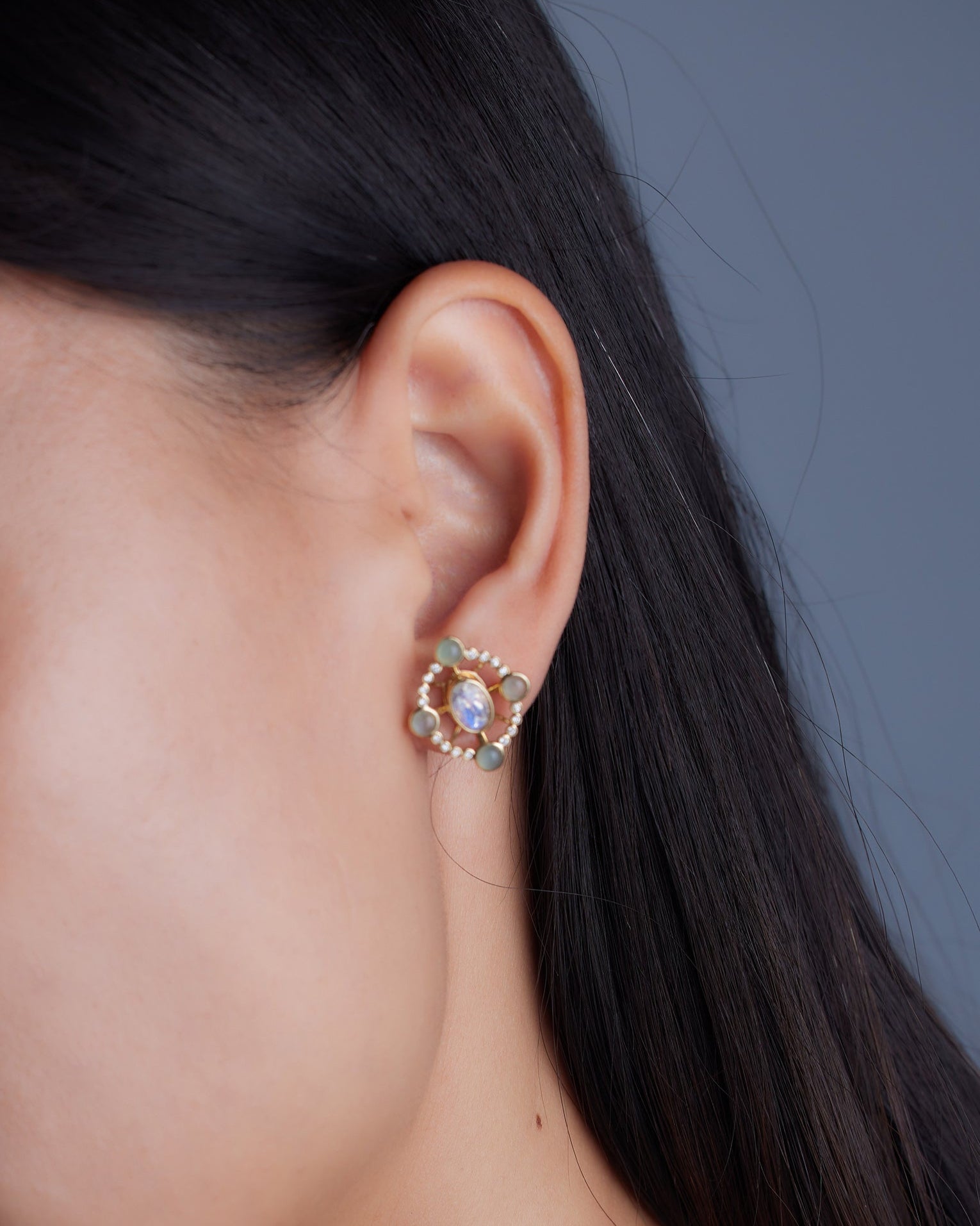 Convertible diamond earrings from Ostara’s Roma collection with moonstone studs; center stone can be customized