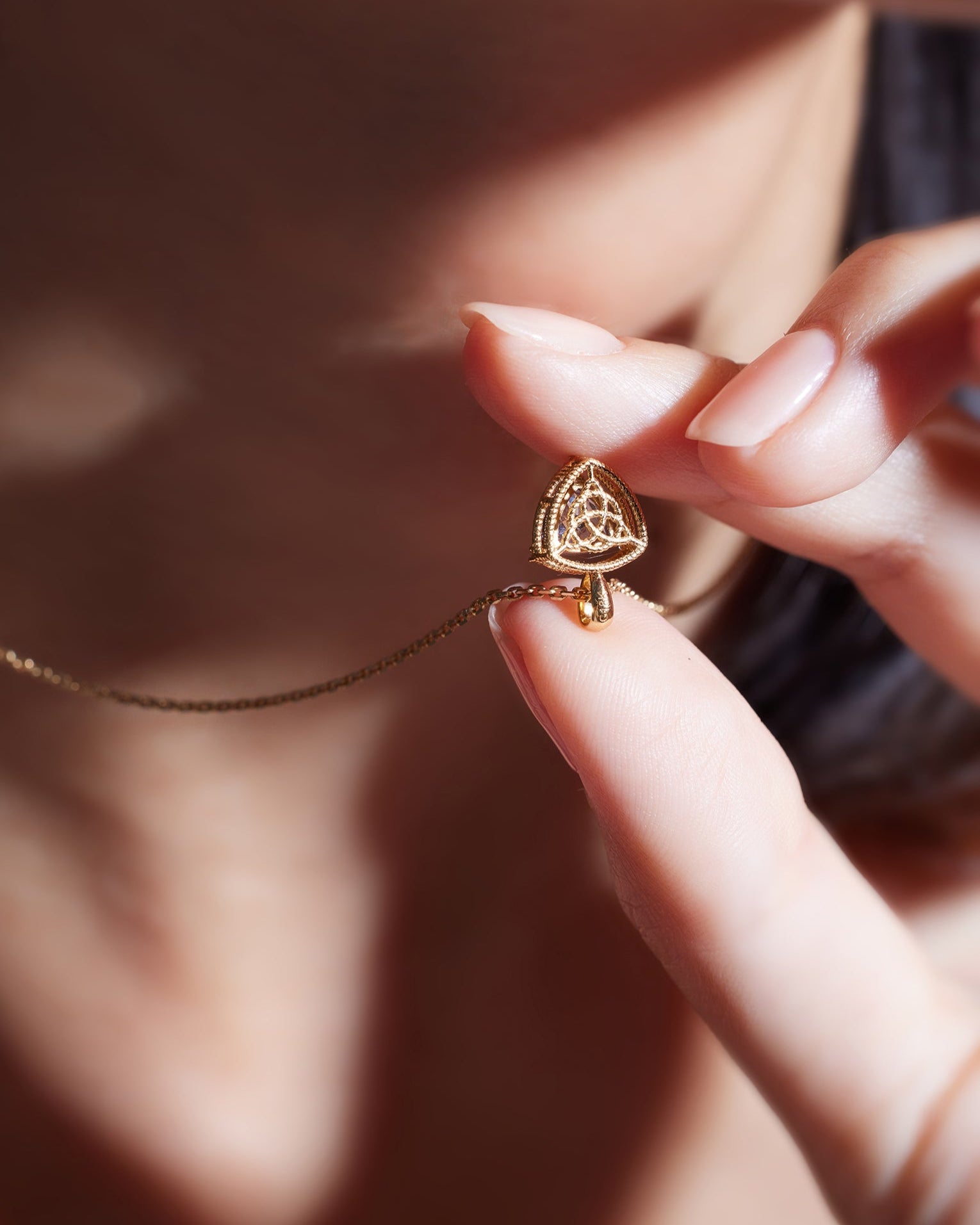 Unheated Tanzanite and diamond necklace in 18K gold from Ostara’s Triquetra collection