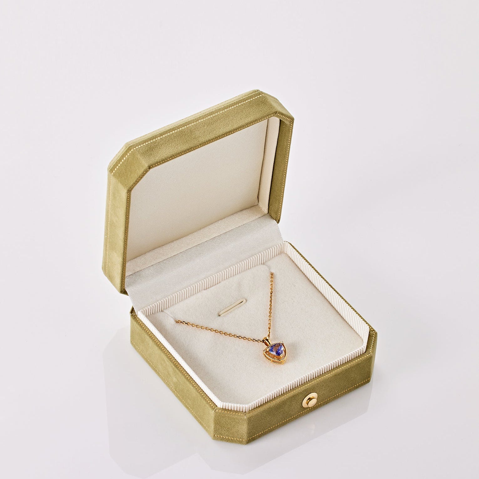 Unheated Tanzanite and diamond necklace in 18K gold from Ostara’s Triquetra collection