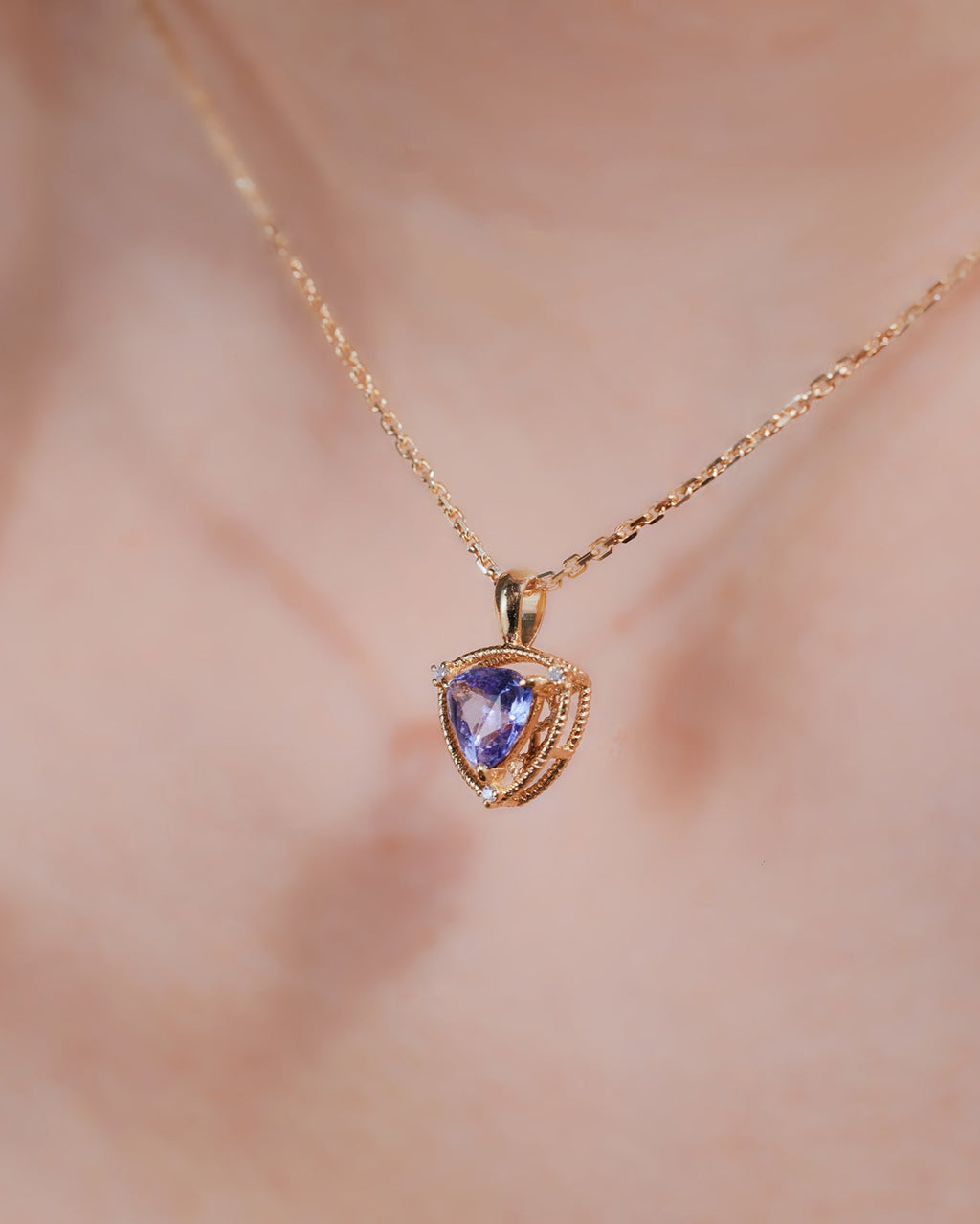 Unheated Tanzanite and diamond necklace in 18K gold from Ostara’s Triquetra collection